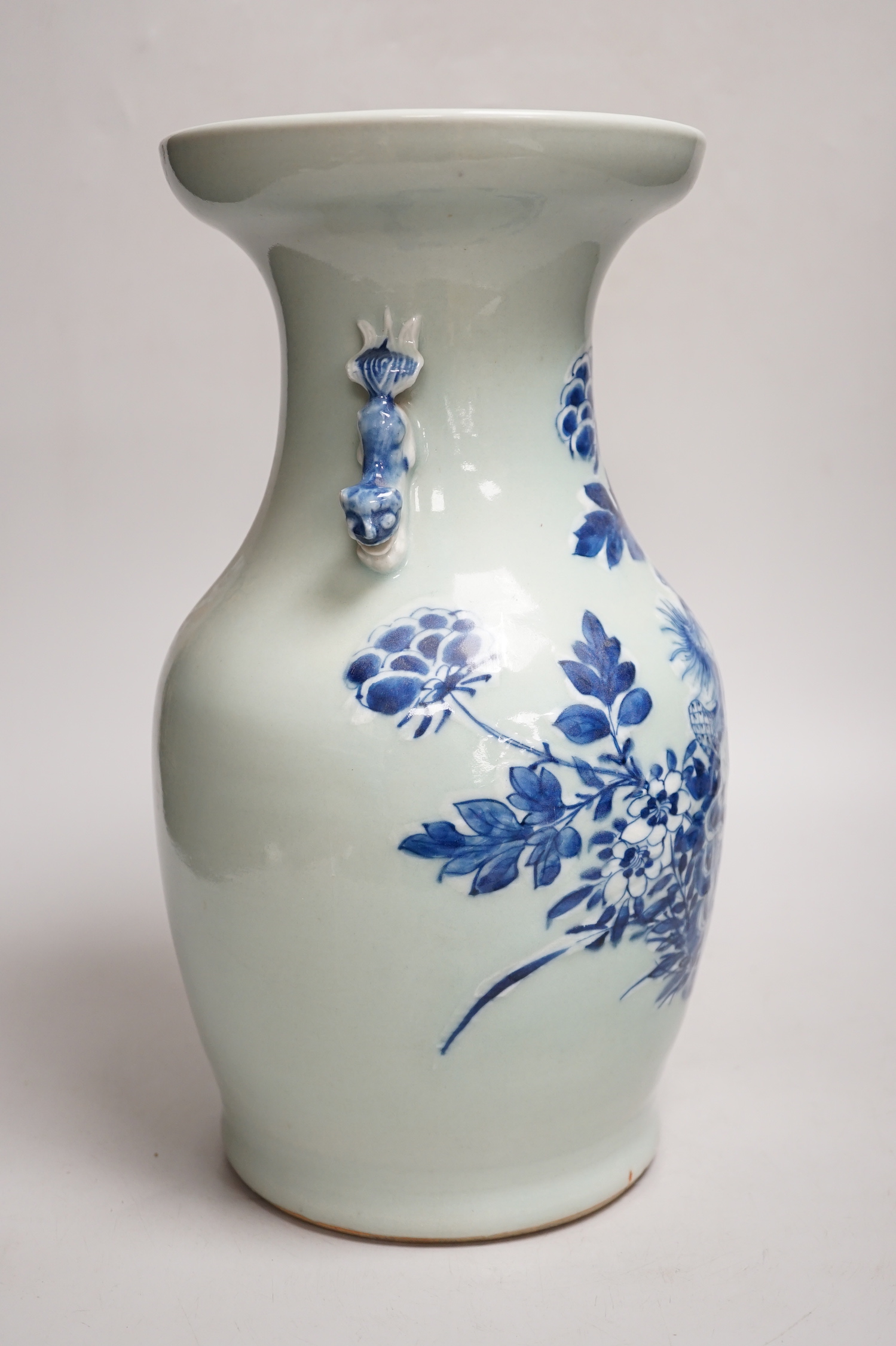 A Chinese celadon ground underglaze blue baluster vase, early 20th century, 34cm